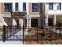 Stylish townhouse exteriors featuring a blend of brick, siding, and landscaping at 334 Olmstead Way # 37, Alpharetta, GA 30022