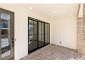 Covered patio with brick flooring and recessed lighting at 334 Olmstead Way # 37, Alpharetta, GA 30022