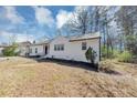 Well-maintained home exterior featuring crisp, white siding and a neatly kept lawn, showcasing suburban charm at 381 Warner Se, Marietta, GA 30060
