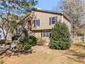 A cozy home featuring a well-maintained lawn and mature trees, offering a tranquil and inviting outdoor space at 610 Amberwood Pl, Euharlee, GA 30145