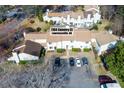 Aerial view of townhouses featuring well-maintained landscaping and convenient parking at 1164 Country Ct, Lawrenceville, GA 30044