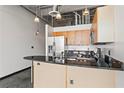 Modern kitchen with stainless steel appliances and a breakfast bar at 5200 Peachtree Rd # 3403, Atlanta, GA 30341