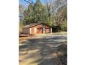 Large detached garage with a two-door entrance and a separate entrance at 1033 Mclendon Dr, Decatur, GA 30033