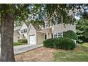 Classic home boasting a single-car garage, a well-manicured lawn, and a fresh exterior paint job at 162 Springbottom Dr, Lawrenceville, GA 30046