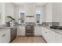 Modern kitchen featuring stainless steel appliances and elegant marble countertops at 380 2Nd St, Fayetteville, GA 30214