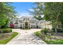 Beautiful home with manicured landscaping, a circular driveway, and a three-car garage at 510 Covington Cv, Alpharetta, GA 30022