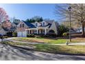 View of a charming two-story home with a brick facade, a two-car garage, and well-maintained landscaping at 500 Sapphire Valley Ln, Canton, GA 30114