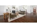 Cozy living room featuring a fireplace, built-in shelves, and hardwood floors at 152 Park Dr, Decatur, GA 30030