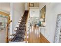 Inviting foyer with a staircase, hardwood floors, and elegant decor at 4212 Lazy Creek Dr, Marietta, GA 30066