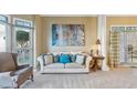 Bright living room with large windows, neutral tones, and comfortable seating at 4212 Lazy Creek Dr, Marietta, GA 30066