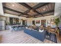 Stylish entertainment space with a modern kitchen, multiple seating areas, and unique ceiling features at 188 Balsam Dr, Dallas, GA 30157