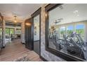 Modern gym area with brick accents and an open-concept design that features treadmills and exercise bikes at 188 Balsam Dr, Dallas, GA 30157