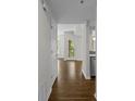Hallway leads to open living space with hardwood floors and natural light at 3636 Habersham Nw Rd # 2208, Atlanta, GA 30305