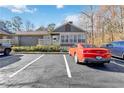 Condo featuring designated parking spaces, neutral exteriors, and tidy landscaping at 2006 Riverview Dr, Marietta, GA 30067