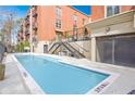 Inviting outdoor pool with clear blue water, surrounded by a deck and nearby stairwell access at 560 Dutch Valley Ne Rd # 2207, Atlanta, GA 30324