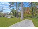 Spacious backyard with mature trees, offering shade and privacy at 701 Daniel Ave, Decatur, GA 30032