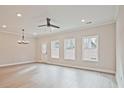 Bright, open living room featuring luxury vinyl flooring, modern fan, and natural light at 175 Bluffington Way, Marietta, GA 30066