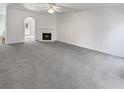 Bright living room features plush carpeting and a cozy fireplace at 20 Pine Canyon Sw Dr # 15, Atlanta, GA 30331