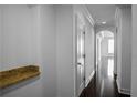 Hallway with dark hardwood floors, arched doorways, and granite countertop at 3445 Stratford Ne Rd # 1101, Atlanta, GA 30326