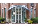 Stunning entrance to the Paces 325 building featuring brick and grand glass doors at 325 E Paces Ferry Ne Rd # 504, Atlanta, GA 30305