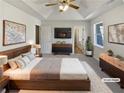 Spacious main bedroom featuring vaulted ceilings, a ceiling fan, and two dressers at 230 Nina Cir, Locust Grove, GA 30248