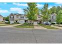 Charming townhome community featuring stone accents, well-manicured landscaping, and attached garages at 258 Ridge Mill Dr, Acworth, GA 30102