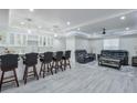 Finished basement featuring a sleek bar area and comfortable seating at 3570 Mill Creek Drive Sw Dr, Smyrna, GA 30082