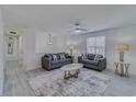 Bright living room with comfortable seating and a ceiling fan at 3570 Mill Creek Drive Sw Dr, Smyrna, GA 30082
