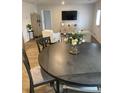 Inviting dining area connected to the living room, with wood flooring and a round table perfect for gatherings at 737 Great Oak Pl, Villa Rica, GA 30180