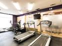 Well-equipped gym space with treadmills, elliptical machine, stationary bike, mirrored wall, and ample lighting at 390 17Th Street Nw # 2026, Atlanta, GA 30363