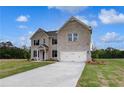 Charming two-story home featuring a well-manicured lawn and a spacious two-car garage at 111 Felicity Pike, Locust Grove, GA 30248