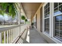 Inviting covered front porch with hanging plants and ample space for relaxing, creating a warm entrance at 1312 Jordan Rd, Powder Springs, GA 30127