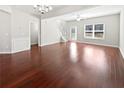 Spacious living area with beautiful hardwood floors, neutral walls, and natural light at 2555 Flat Shoals Rd # 3103, Atlanta, GA 30349
