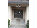 The entrance to the house has double doors and a sign above the door with the address at 3030 Parc Lorraine, Lithonia, GA 30038