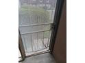 The patio has a metal screen door and concrete flooring at 3030 Parc Lorraine, Lithonia, GA 30038