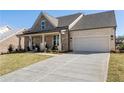 Well-maintained home featuring a two-car garage and a freshly poured concrete driveway at 5120 Token Chase, Cumming, GA 30040