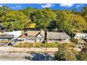Aerial view of residential homes surrounded by trees and a restaurant at 1640 Lakewood Se Ave, Atlanta, GA 30315