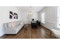 Bright home office featuring hardwood floors, a large desk and a comfortable sofa at 350 Newcastle Dr, Alpharetta, GA 30009
