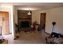 Bright living room featuring wood floors, a brick fireplace, and neutral paint colors at 754 Walnut Sw Cir, Marietta, GA 30060