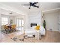 Open living space with decorative fireplace, hardwood floors, and an eat-in kitchen with modern features at 2722 Glenbriar Ne Dr, Atlanta, GA 30345