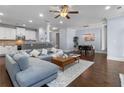 Spacious living room seamlessly connects to the kitchen and dining area with modern finishes at 7630 Glisten Ave # 304, Atlanta, GA 30328