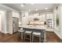 Spacious kitchen with stainless steel appliances, granite countertops, and a large center island with seating at 2750 Vinings Orchard Se Cir, Atlanta, GA 30339