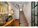 Spacious foyer with hardwood floors and staircase at 2314 English Ivy Se Ct, Atlanta, GA 30339