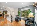 Comfortable sitting area with large window, hardwood flooring, and stylish decor at 2314 English Ivy Se Ct, Atlanta, GA 30339