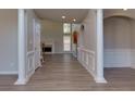 Inviting foyer with hardwood floors and view to the living room at 1368 Fall River Dr, Conyers, GA 30013