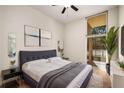 Bright bedroom featuring a neutral palette, contemporary art, and a large window for natural light at 3400 Malone Dr # 110, Atlanta, GA 30341