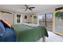 Serene main bedroom featuring a king-size bed and a private screened deck overlooking the outdoors at 6510 Akins Way, Cumming, GA 30041