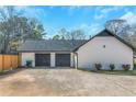 Spacious two-car garage with ample parking, offering convenience and storage solutions at 165 Sugarland Trl, Fayetteville, GA 30214