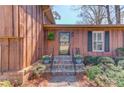 Charming front entrance with stone steps and mature landscaping at 2685 Whippoorwill Cir, Duluth, GA 30097