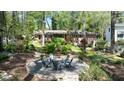 Charming backyard featuring a circular stone patio with comfortable seating at 4323 E Durham Cir, Stone Mountain, GA 30083